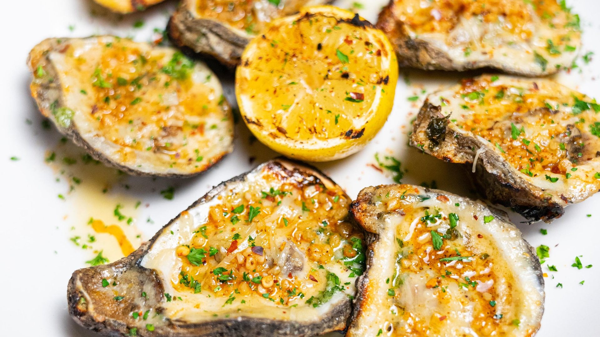 Grilled oysters on the half shell at Seaside Lounge