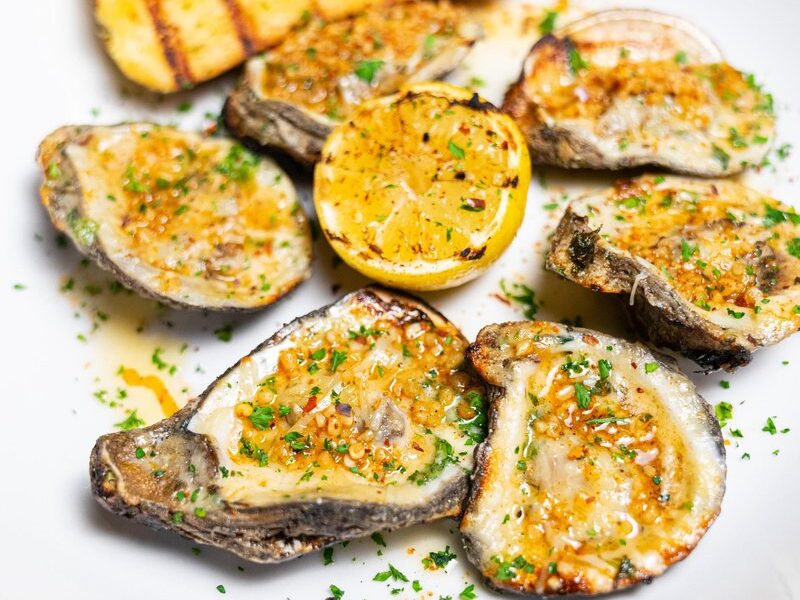 Grilled oysters on the half shell at Seaside Lounge